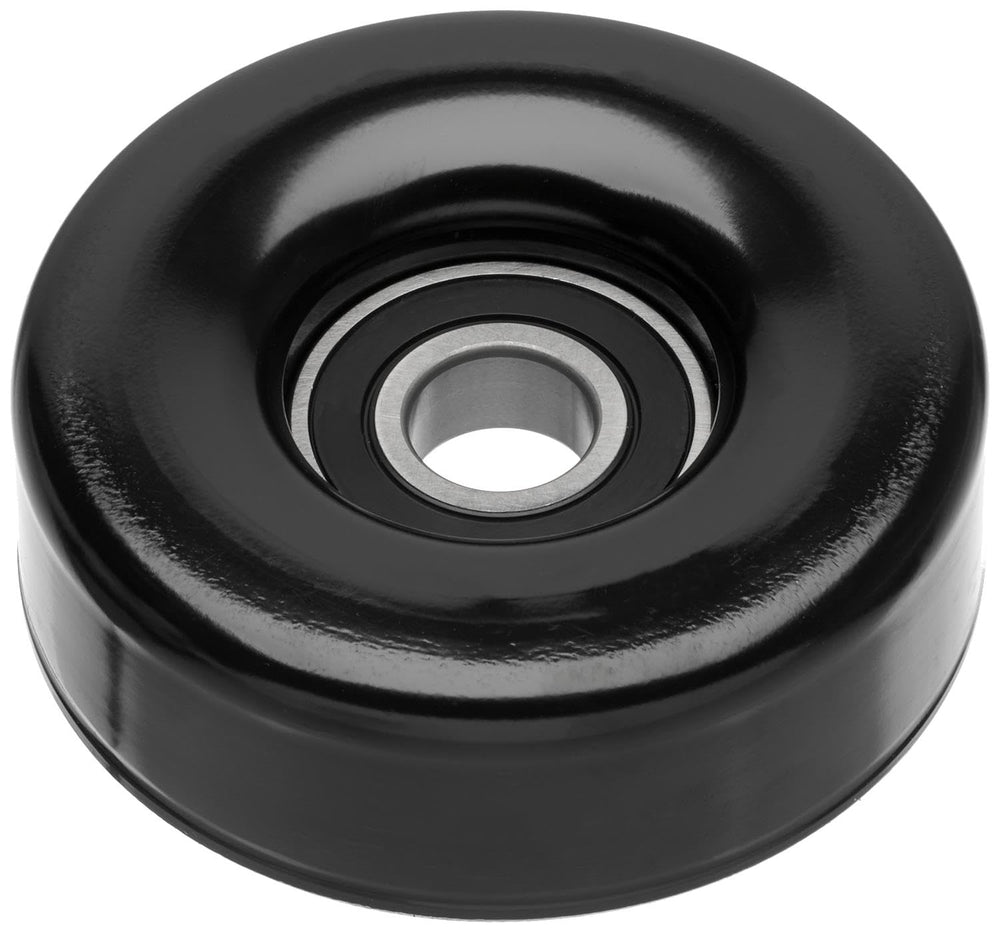 ACDelco Gold idler pulley front view showing mounting hole and smooth surface, ensures correct belt routing