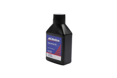 ACDelco being poured into a supercharger reservoir for clean service
