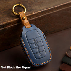 Aoocar key fob in hand showing compact size and easy grip