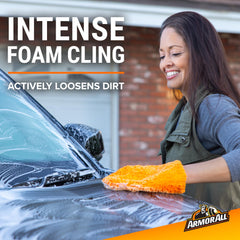 Armor All foam applied to car hood illustrating long-lasting suds effectiveness