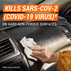 Armor All wiping dashboard to remove dust and provide clean finish