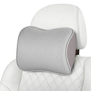 Aukee front view headrest pillow showing sleek grey leather and compact profile for comfort