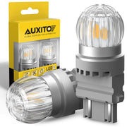 AUXITO front view of two 3157 amber LED bulbs showing fit and finish, clear upgrade