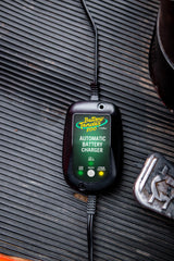 Battery Tender mounted on ATV demonstrating secure outdoor mounting and vibration resistance benefit