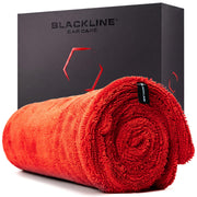 Blackline front view of 24x36 towel showing size and packaging benefit fast drying