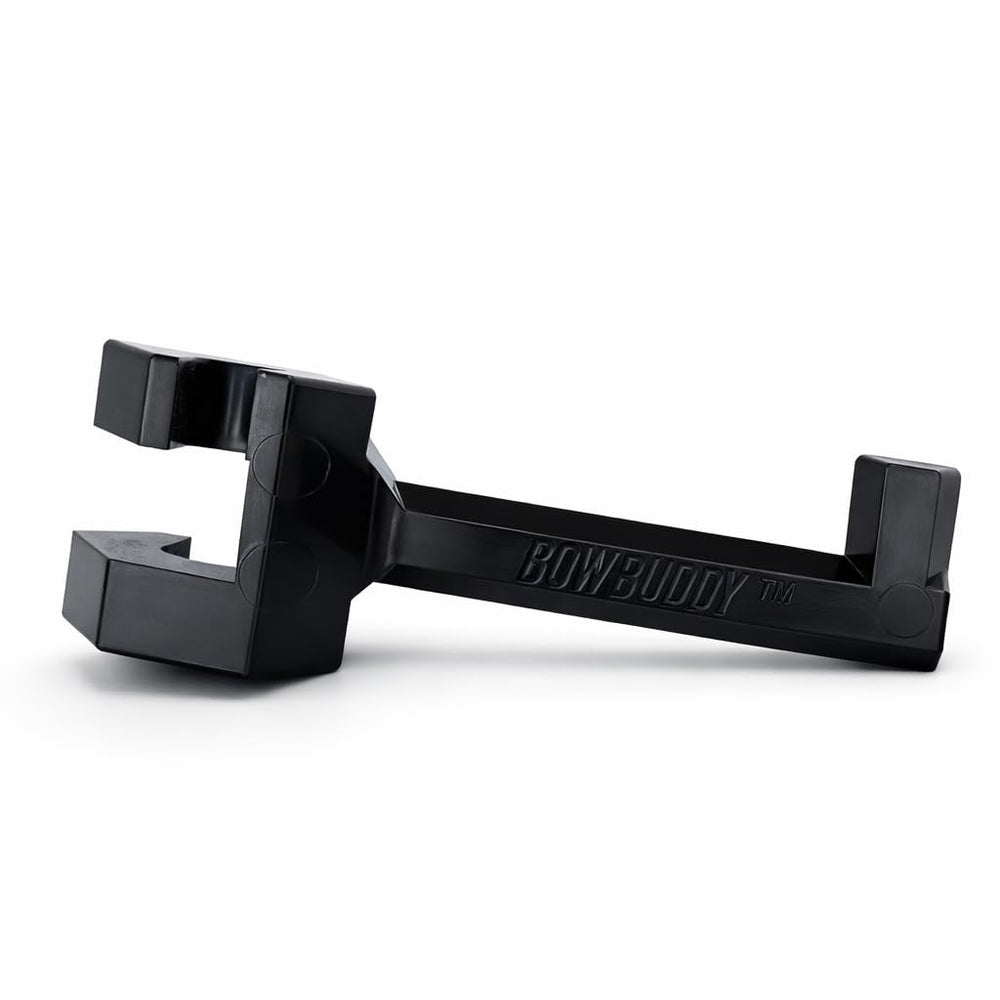 Bow Buddy headrest hanger holding a helmet keeps cab organized