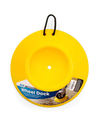 Camco wheeldock placed under trailer wheel preventing sinking on soft ground