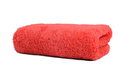 CARCAREZ towel held in hand to show 16x16 inch scale and easy handling for drying