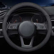 Carodi front view of black 15-inch steering wheel cover showing sleek design and fit