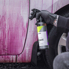 CARPRO reaction close-up showing dissolved iron particles and visible cleaning benefit