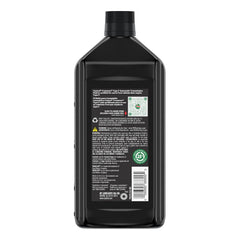 Castrol Transmax Type F bottle being poured into transmission to ensure proper lubrication