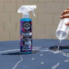 Chemical Guys spraying HydroThread on car seat to protect fabric
