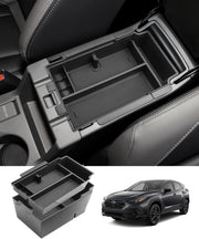 Coleya front view installed in Crosstrek armrest showing neat organization