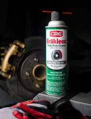 CRC Brakleen spray in use on caliper removing grease for easier repairs