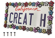 creathome front frame matt black showing full daisy wreath and bold contrast