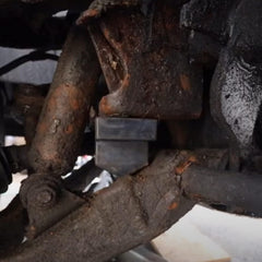 Dasbecan bumper stop installed on control arm demonstrating secure fitment