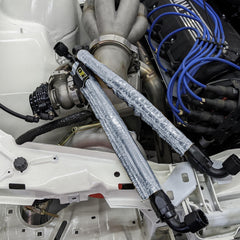 Design Engineering Heat Sheath slipped over engine hose in bay, reducing heat exposure