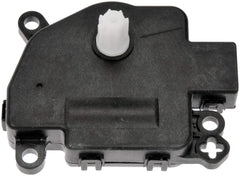 Dorman actuator next to ruler showing compact size for easy fitment