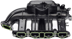 Dorman kit components laid out to show complete intake manifold, valve cover, and PCV tube