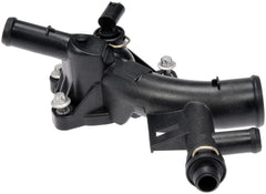 Dorman outlet installed on engine illustrating proper fit and improved coolant flow