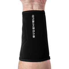 EvoShield wrist guard next to measuring tape showing size fit benefit