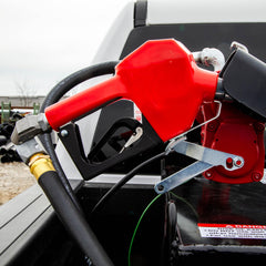 Fill‑Rite SDN075RAN in use refueling a truck demonstrating automatic shut‑off reduces spills and speeds work