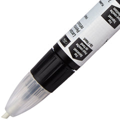 Ford touch-up paint used in a car repair setting for quick blemish concealment