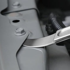 FWTW wedge in use prying vehicle trim illustrating safe non-marring removal benefit