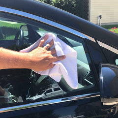 GrabaRag cloth held in hand to show 11.7x12.3-inch size and easy handling