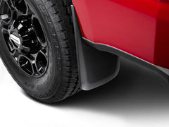 Husky Liners mud guards installed on Ford F-350 protecting rear panel from spray