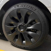 KAVANIC front view of four matte black wheel covers showing modern turbine styling and protection