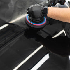 KOCHCHEMIE H9.02 bottle mounted on a polisher demonstrating professional usability