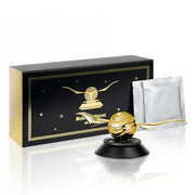 Kwak's gold air freshener front view showing decorative wings and finish benefits ambiance