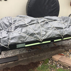 LE KAPMOZ installed on a pickup truck bed showing practical anchor placement for cargo