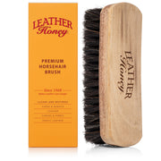 Leather Honey brush front view showing walnut handle and bristles for controlled cleaning
