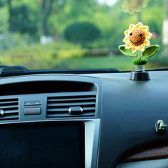 Levvohd sunflower attached on car dashboard offering cheerful, non-damaging decor