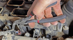 Lisle 37980 close-up of hooked tip engaging connector tab to prevent damage while releasing