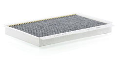 Mann Filter activated carbon layer close-up showing media texture and improved odor control