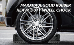 MAXXHAUL chocks placed against RV tire demonstrating stability and easy deployment