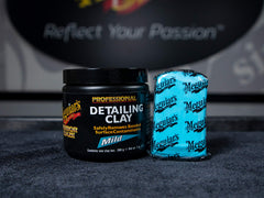 Spraying Meguiar's lubricant with clay in use to protect paint and prevent marring