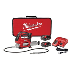 Milwaukee M18 2646-22CT grease gun in use on a bearing delivering precise grease for maintenance