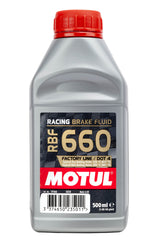 Motul RBF 660 bottle in use during brake bleeding showing clean service