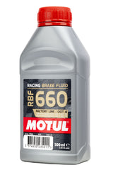 Motul RBF 660 bottle beside a ruler showing 500ml scale for capacity