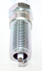 OVERSTOCKDIRECT spark plug installed in engine bay demonstrating proper seating and reliable ignition