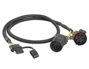 Oyviny front view of USCAR 7 to 4 harness showing plug and cable, simplifies installation
