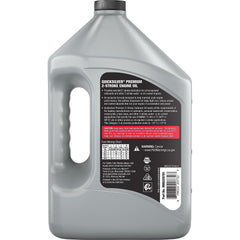 Quicksilver being poured into a marine outboard demonstrating correct premix use