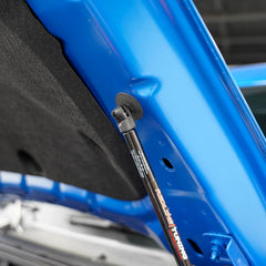Redline Tuning gas spring close-up highlighting smooth lift and corrosion resistance