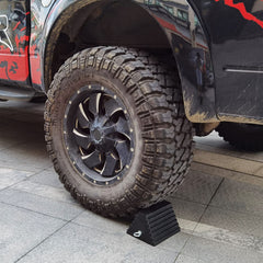 ROBLOK chock placed under RV tire demonstrating vehicle stability