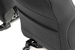 Rough Country seat covers installed in Tacoma front seats showing snug factory fit benefit