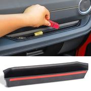 Savadicar front tray showing clean black finish and quick storage benefit